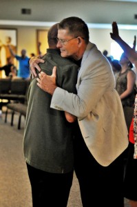 Glen Middleton embraces Pastor Pat Forbes